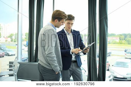 Two businessman dicussing business in the office