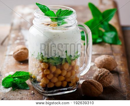 minty yogurt parfaits in the jar.style rustic.selective focus