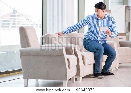 Young man shopping in furniture store