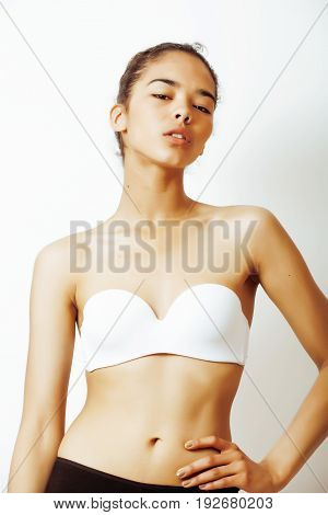young pretty african american woman close up isolated on white background, asian  taned nude makeup, lifestyle spa real beauty people concept close up, copyspace
