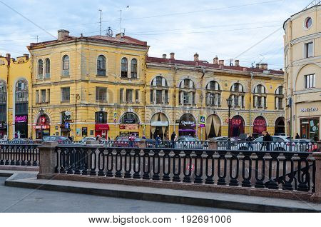 SAINT PETERSBURG RUSSIA - MAY 1 2017: Unknown people walk along embankment of Griboyedov Canal St. Petersburg Russia