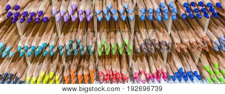 Wooden colored pencils on a shelf Colored Pencil Tips Colorful Spectrum Shelf Background Stacks Groups Rainbow