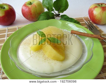 Homemade gluten free dessert with blancmange from maize starch and stewed apples