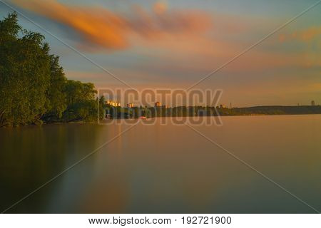 Orange And Red Sunset At Coast Of The Lake