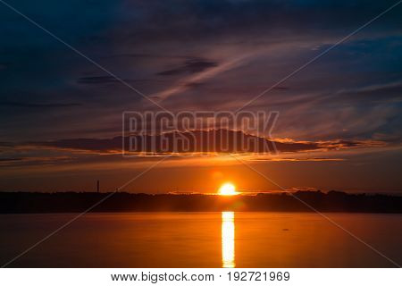 Orange And Red Sunset At Coast Of The Lake