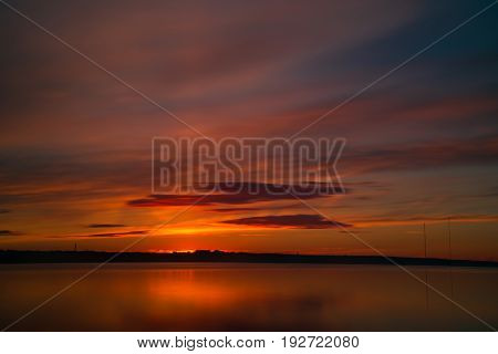 Orange And Red Sunset At Coast Of The Lake