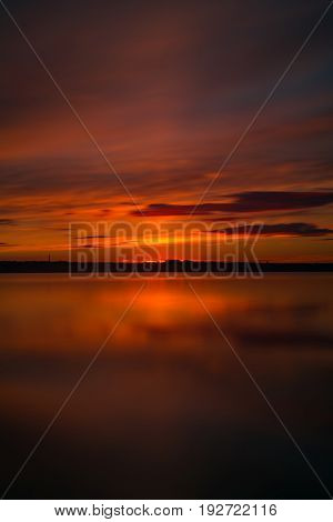 Orange And Red Sunset At Coast Of The Lake