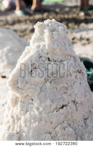 A hill made of salt on the beach. Salt spa.
