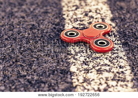 Popular spinner gadget in 2017 on a blue and white background.