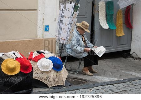 He Elderly Woman Sells Handmade Crochet, Knittware In Pilies Street