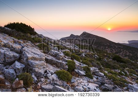 Sunset over mountains near Kamares village on Sifnos island, Greece.