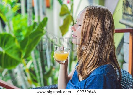 Young Beautiful Redhead Woman Sitting In A Cafe Drinking A Delicious Morning Ginger Tea In A Cafe