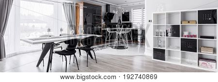 Graphic dining room with modern kitchen annex