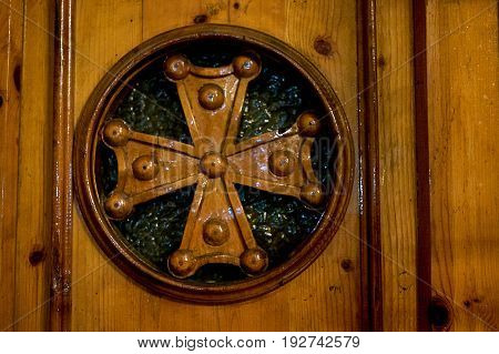 an old wood door with cross in Church of the Holy Sepulcher in Jerusalem