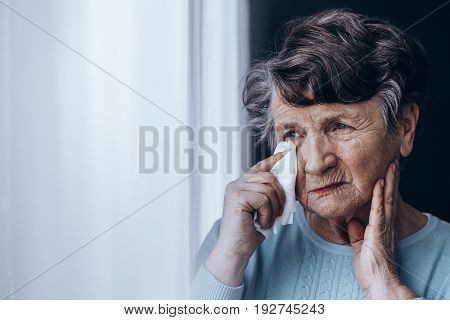 Elderly Woman With Teary Eyes