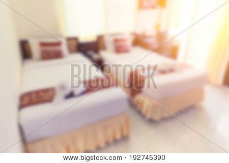 blur hotel bed bedroom double bed white clean hotel room for background.