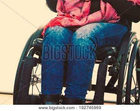 Disease disability paralysis handicap health concept. Legs of disabled person. Crippled female sitting on wheelchair.