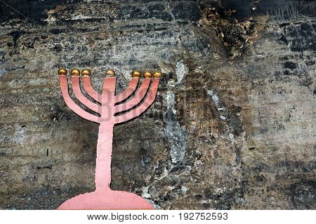 Old candelabra and From the cave of Elijah the Prophet stone background