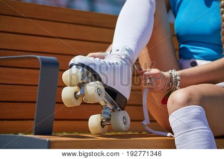 The girl assumes roller skates