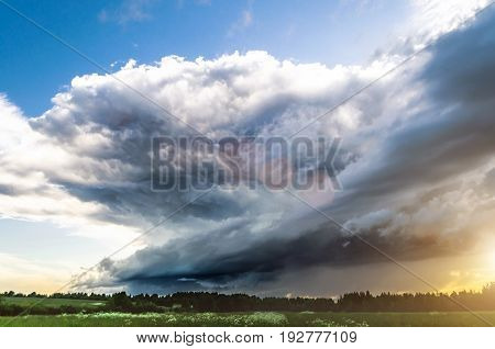 Supercell Thunderstorm Sunset And The Blue Sky And Cirrus Clouds.