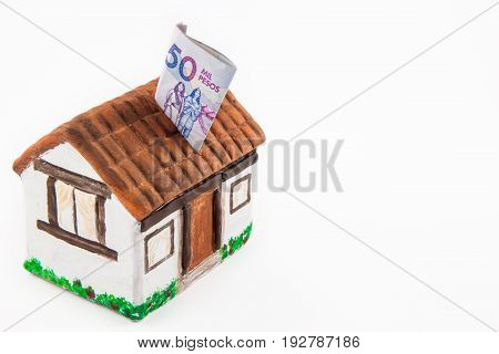 Saving Fifty Thousand Colombian Pesos Bills to buy a house