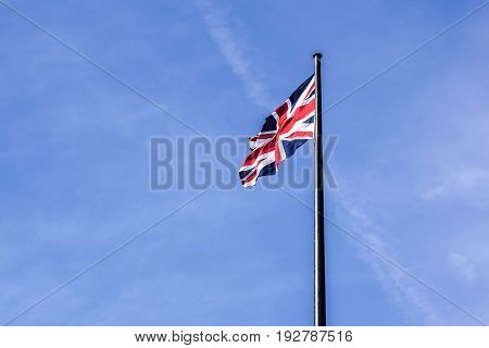 The British flag waving in the wind .