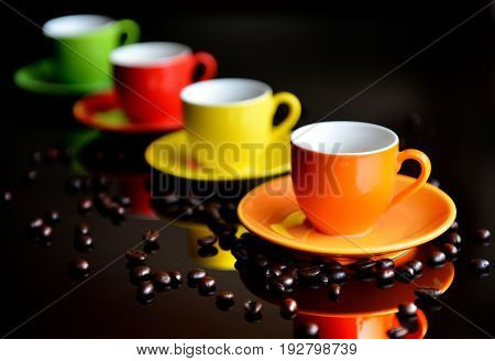 Colorful coffee cupon coffee beanred yellow green and orange