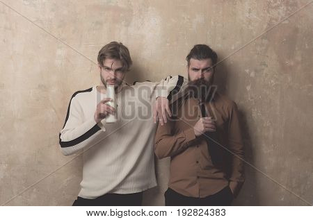 Man With Yogurt And Brutal Model With Wine Bottle