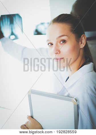 Doctors analyzing an x-ray in a meting. Doctors