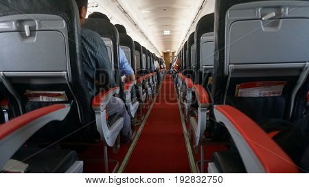 Interior of airplane with passengers on seats .waiting to take off.