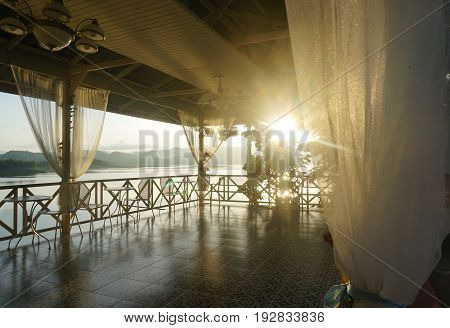 The balcony in the morning sunshine. light shine through the curtain