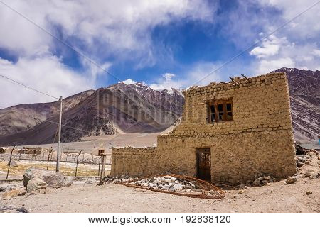Traditional buiding with snow peaks background,  Leh ladakh; India