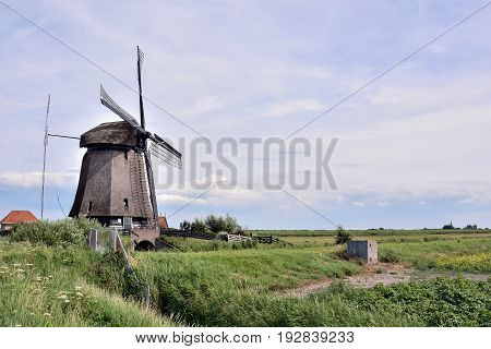 Classic Vintage Windmill In Holland