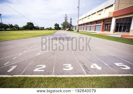 Gray treadmill at the stadium with the numbering from one to seven