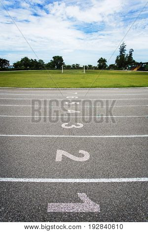 Gray treadmill at the stadium with the numbering from one to eight