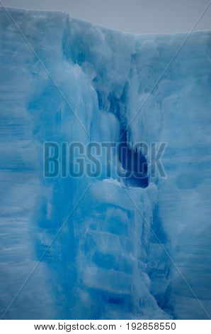 A large tabular iceberg floating in the southern atlantic ocean, near Antarctica.