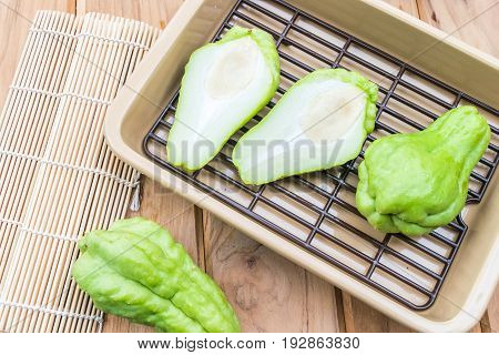Fresh Chayote fruit on wooden table background