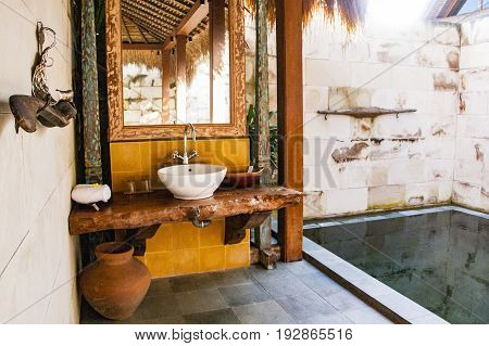 Bali Interior of luxury tropical bathroom with private swimming pool Indonesia