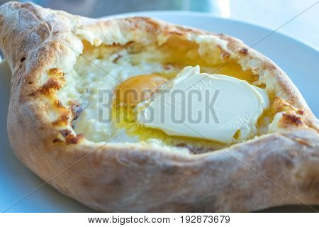 Adjarian Khachapuri With Eggs On The Table
