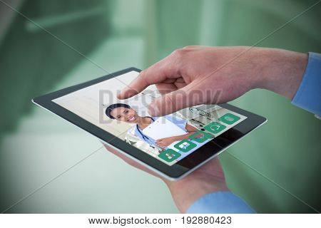 Croped hands of businessman using digital tablet against empty bed in the hospital room