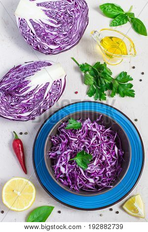 Purple cabbage salad in bowl And ingredients on white background. Top view