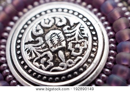 Seed bead embroidered lilac mandala with metal button. Hand made art object
