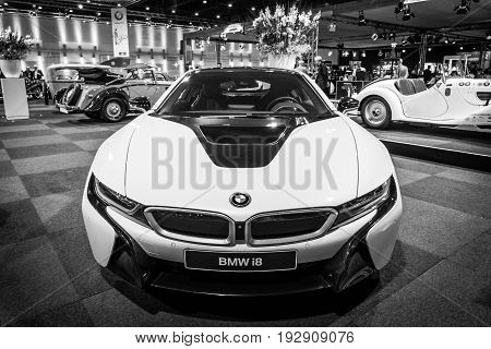 MAASTRICHT NETHERLANDS - JANUARY 14 2016: Plug-in hybrid sports car BMW i8. Black and white. International Exhibition InterClassics & Topmobiel 2016