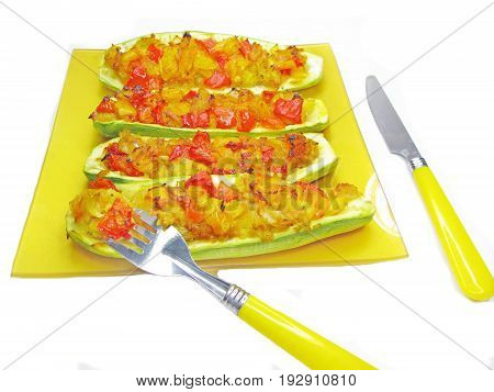stuffed marrow vegetable tomato with parsley and fennel on the plate