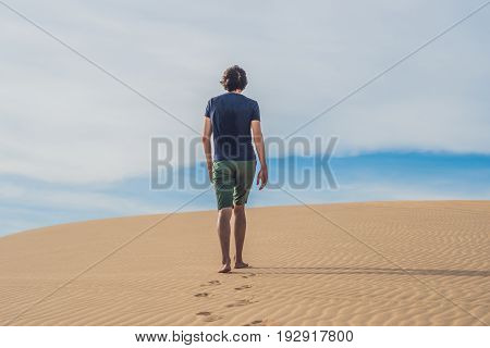 A Man Is Walking In The Desert Vietnam, Mui Ne