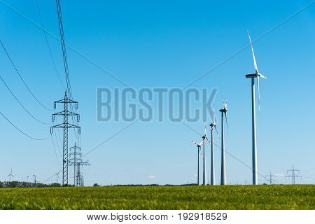 Wind turbines and power transmission lines seen in rural Germany