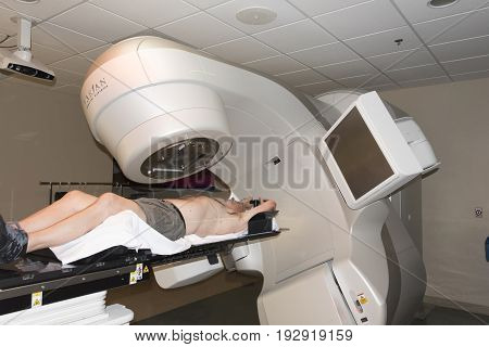 Patient Radiation therapy showing laser lines for targeting cancer cells in the brain and Throat