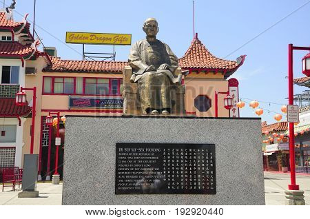 May 22 2017. Los Angeles California. The East Gate entrance to Los Angeles Chinatown in sunny california. Dr Sun Yat-sen sitting statue in the central plaza.