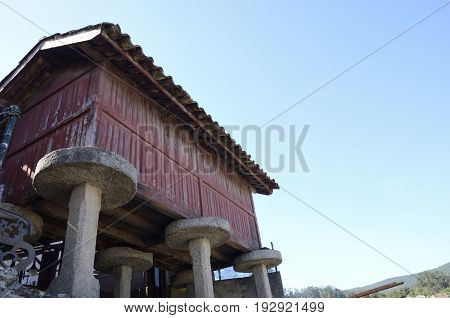Horreo typical elevated granary in Combarro a village of the province of Pontevedra in the Galicia region of Spain.