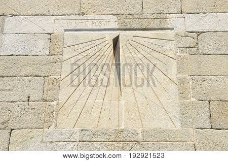 Sundial engraved on wall church in Pobra, Galicia, Spain